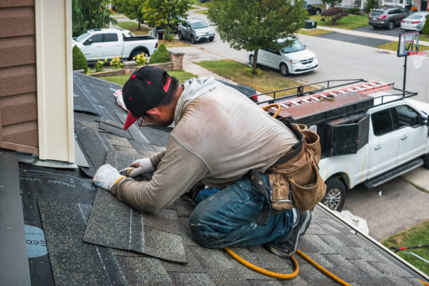Professional Roof Replacement technician working in Malta, IL